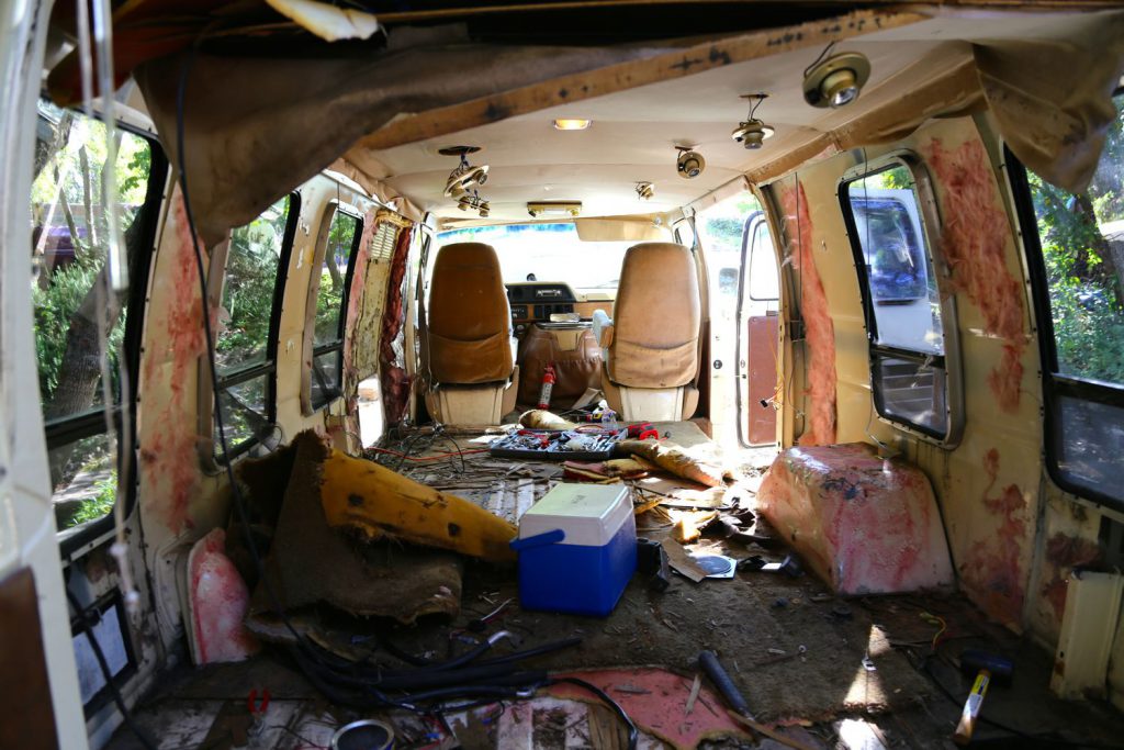 Stripping the van took several days.  Here, we had removed the interior walls but were only beginning on the roof and flooring.  Not all of the insulation was so easily removed.