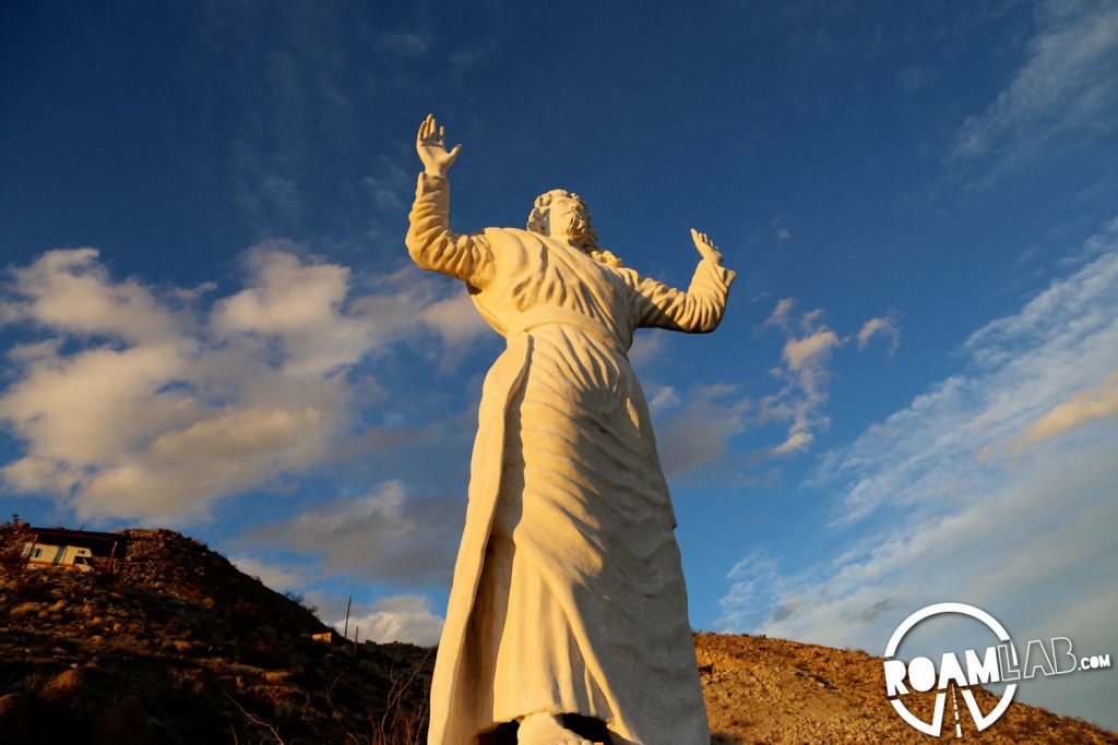 This displaced Jesus was originally intended to be perched on the Grand Canyon. Without the needed permission to place it where he pleased, artist Frank Antone Martin agreed to bring the oversized savior to this desolate mountain side.