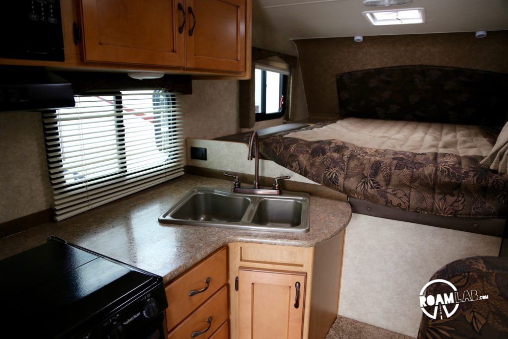 This is the counter of the Adventurer Truck Camper Model 89RB, which we are considering. it has a bit more counter top than some of the other models but the stove cover is not flush with the counter. It's still useful, but just a little less so.