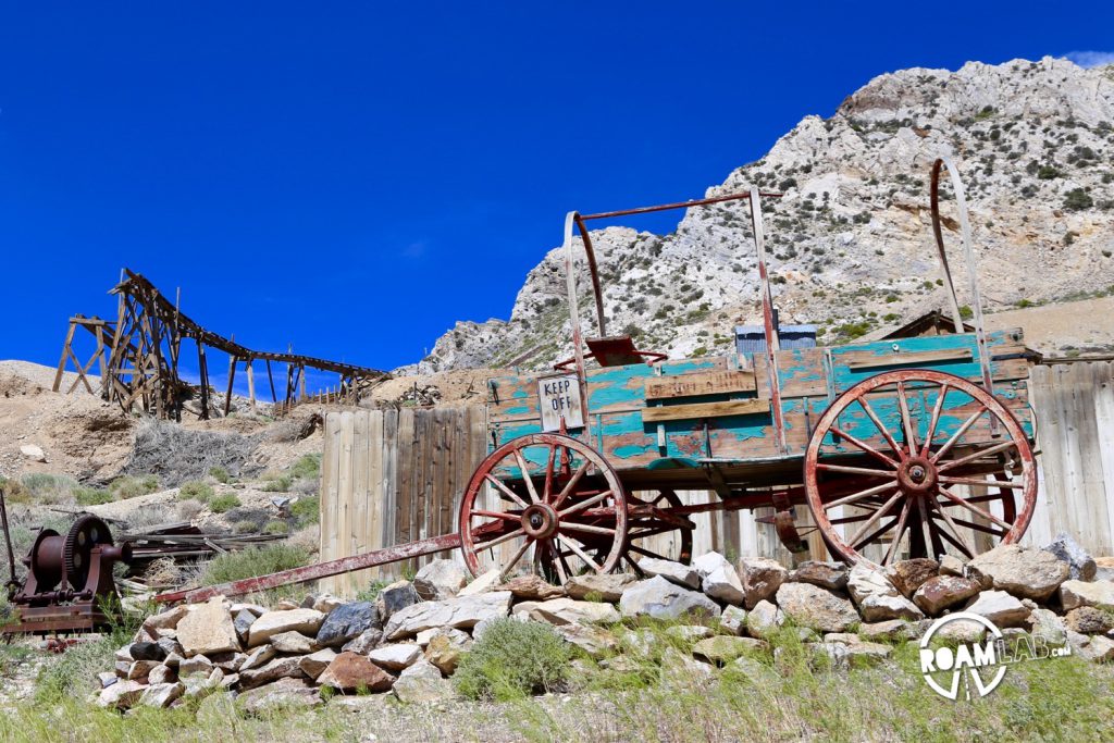 An old wagon near a breaking down rail trellis once used for moving rich iron-silver ore.