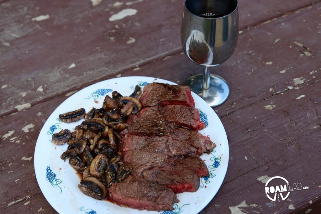 Steak and mushrooms, ready to eat.