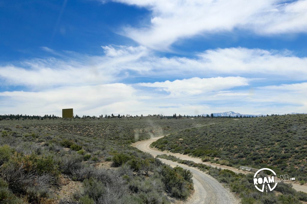 Unnamed dirt road meeting with the main road.