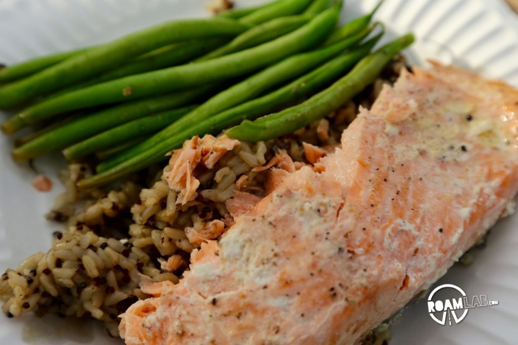 Dinner is complete with foil wrapped salmon and green beans and skilled cooked quinoa.