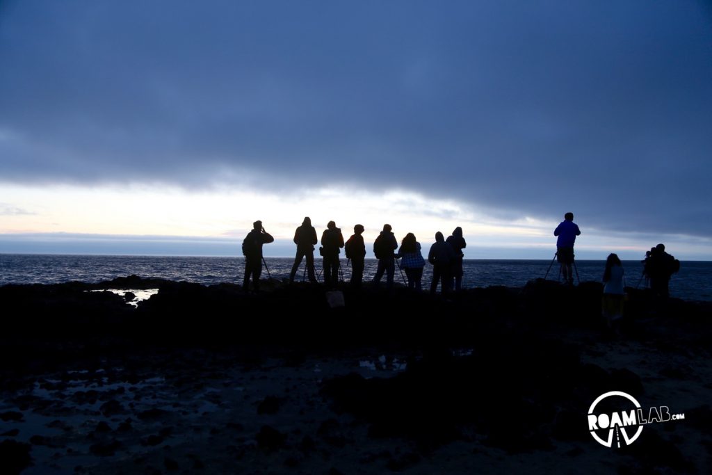 Thor's Well draws photographers, striving to capture the perfect shot of this natural wonder. Tonight, photographers lined the rim of the well with tripods and massive SLRs.