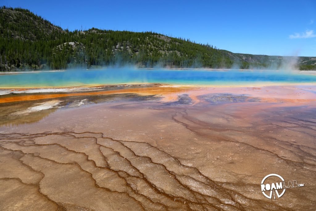 Steam rises off of the Grand Prismatic Spring, the largest hot spring in America.