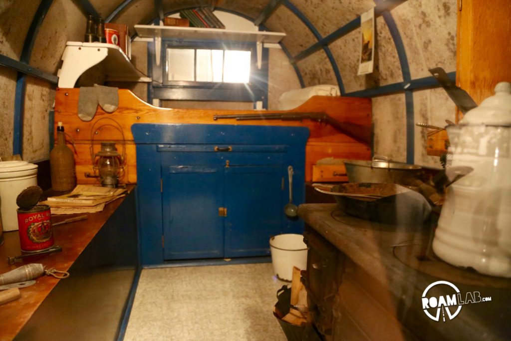 Interior of a 1915 sheep wagon. It's fascinating to see how similar the layout is to modern day truck bed campers. Both include a bed, kitchen area and storage in similar layout just a cast iron stove makes for a much heavier load.