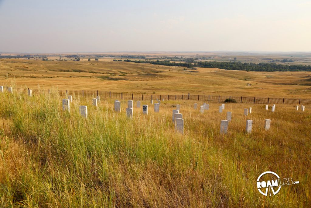 A dense collection of gravestones marking the locations where men fell in Custer's last stand. The black stone marks Custer's final resting place.