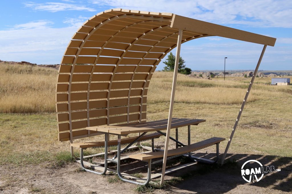 There are several covered picnic tables scattered around the camp site. They are not directly associated with a specific camp site and are quickly claimed by the first campers to arrive at any day.