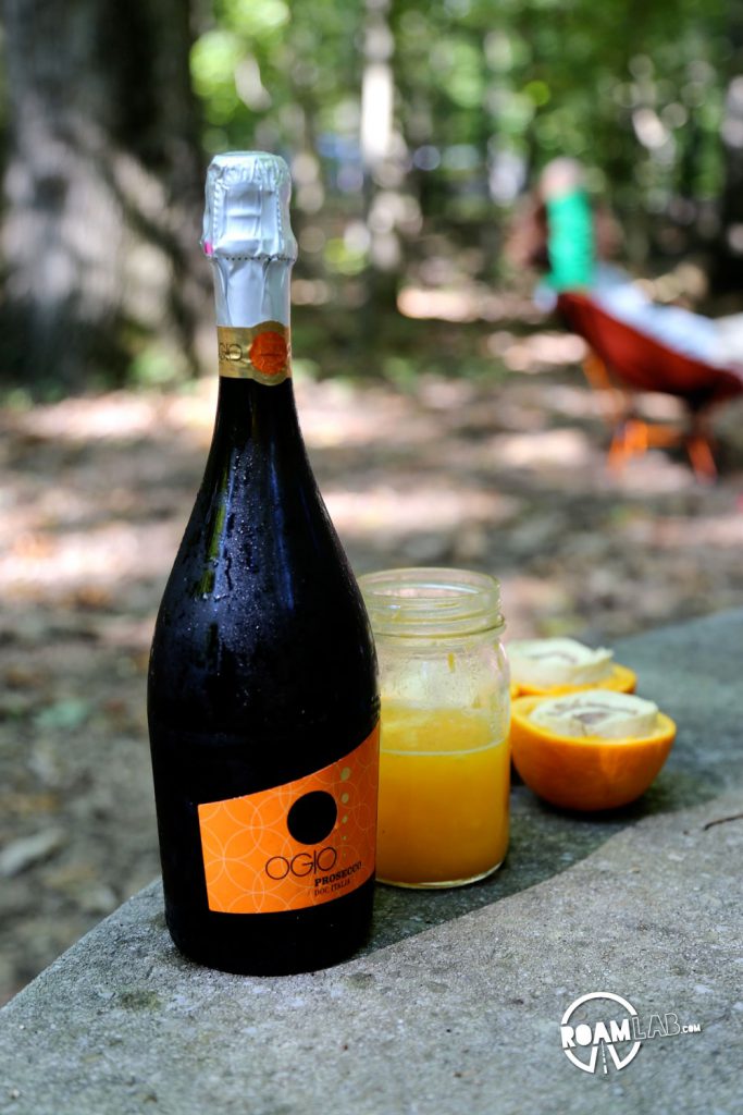Ready for mimosas: sparkling wine and freshly squeezed orange juice - the remnants of Big Boys & Girls Boozy Campground Orange Sticky Rolls