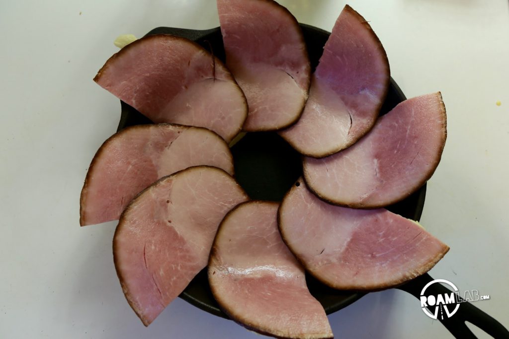 We had a left over tube of crescents and slices of ham, so we decided to bring those two together to make a fun and tasty breakfast combo: the  Dutch Oven Breakfast Ring