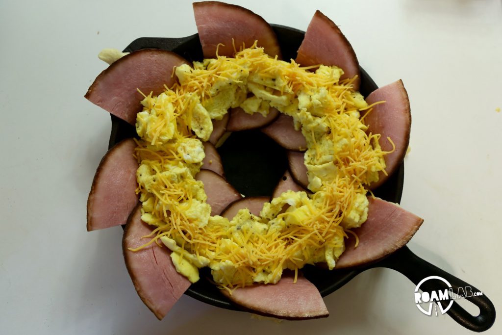 We had a left over tube of crescents and slices of ham, so we decided to bring those two together to make a fun and tasty breakfast combo: the  Dutch Oven Breakfast Ring