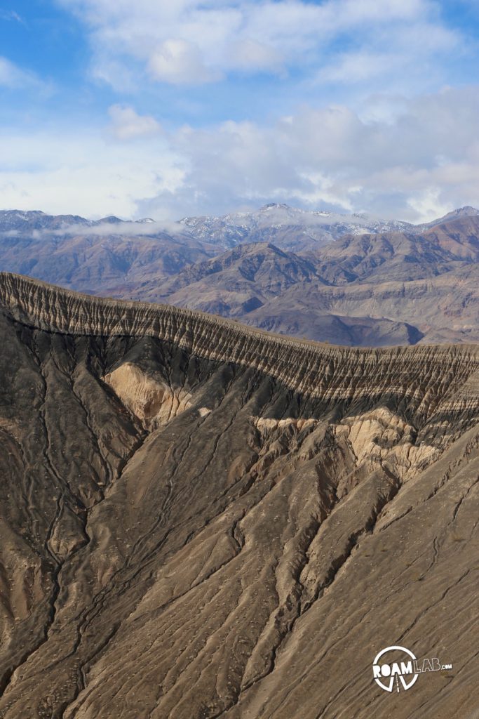 The road to the Racetrack Playa in Death Valley National Park is one long, brutal washboard past volcanic craters, Joshua Trees, and teakettles to a dry lakebed punctuated by a grandstand rock formation and sailing stones.