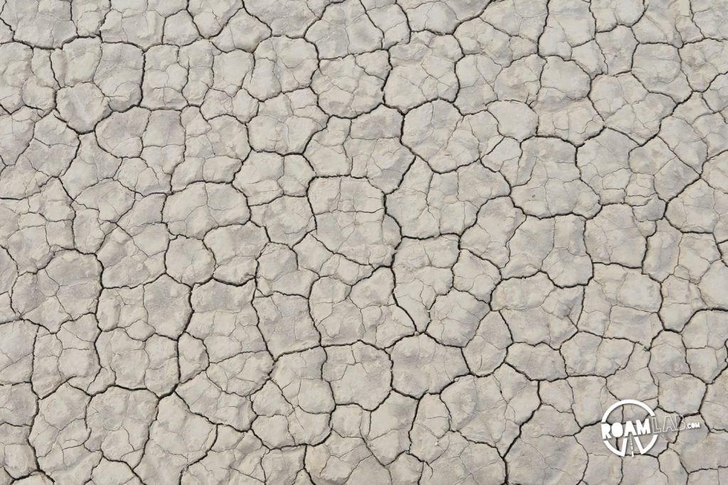 The road to the Racetrack Playa in Death Valley National Park is one long, brutal washboard past volcanic craters, Joshua Trees, and teakettles to a dry lakebed punctuated by a grandstand rock formation and sailing stones.