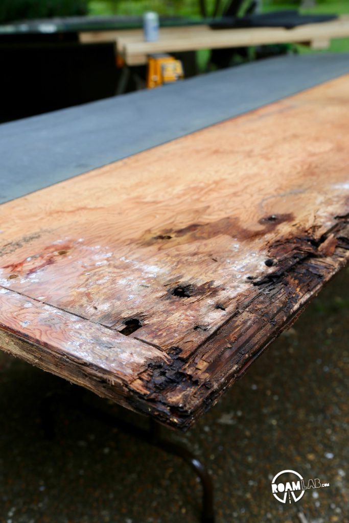 The two large, noticeable holes on this rotten board are where the jack point was mounted.  A little lower in the shot are two other holes in the middle of all the rotten wood...yeah, that was the tie down point.  I'm just grateful it didn't give before we had a chance to replace it.