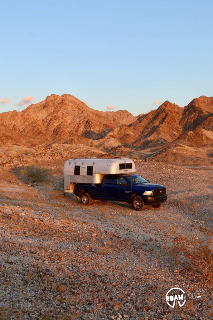 Sunset at our campsite in the Cargo Muchacho Mountains with our Avion Ultra truck camper.