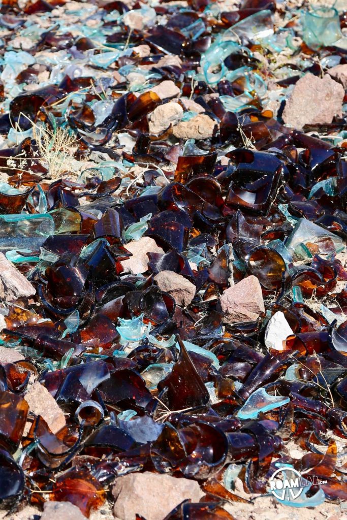 Shattered glass is common around historic mining sites. This is just fresher than the glass we normally encounter.