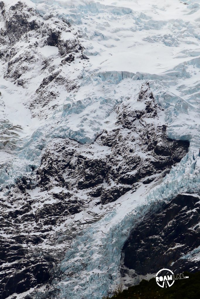 Contending against gale force winds to see a glacier on the Hooker's Valley Track along the Southern Alps in Aoraki/Mount Cook National Park.