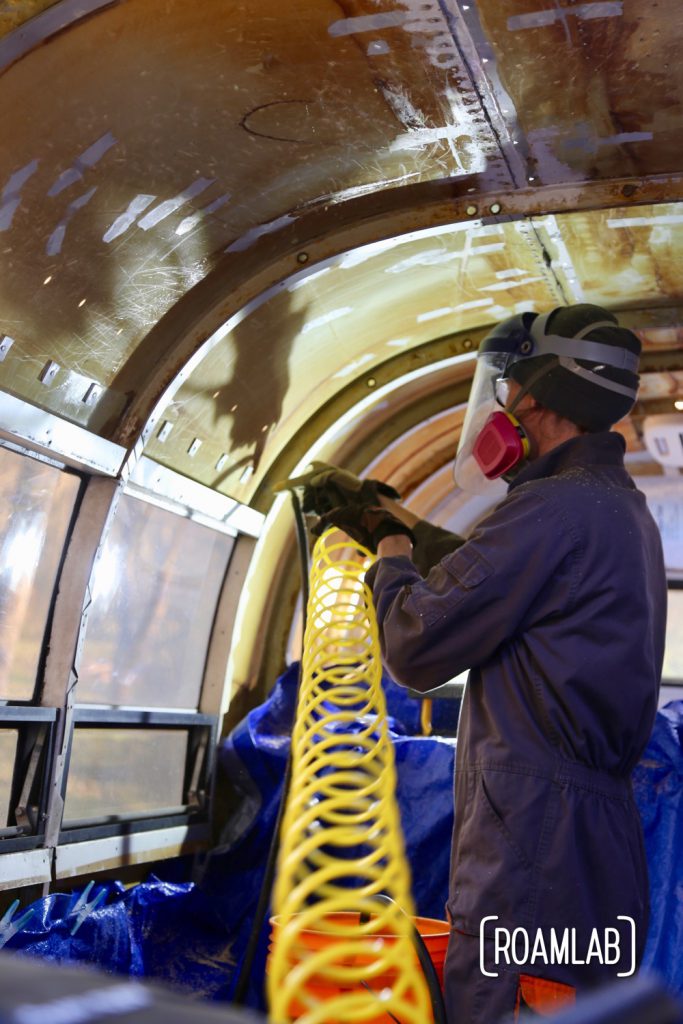 A final surface cleanup running walnut shells through a blaster while renovating a vintage 1970 Avion C11 truck camper.