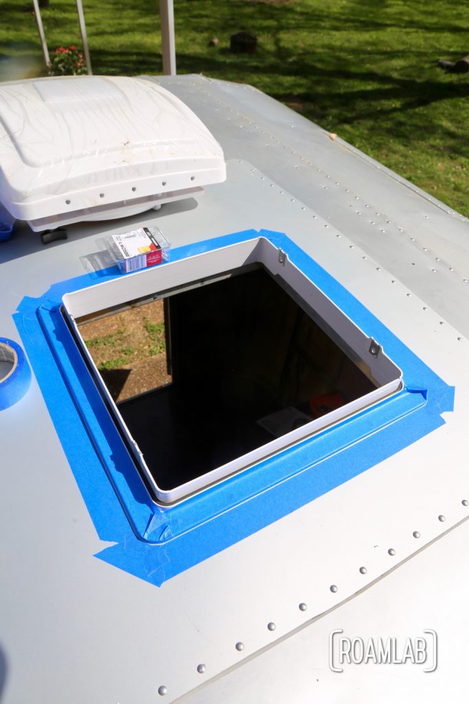 To make sealing the frame in place a little less messy, I taped the surrounding area for easy cleanup of any sealant-adhesive that squeezes through for a DIY MaxxAir Fan installation.