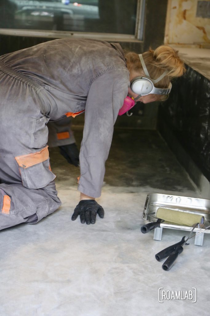 Wetting down fiberglass cloth to re-enforcing the truck camper floor.