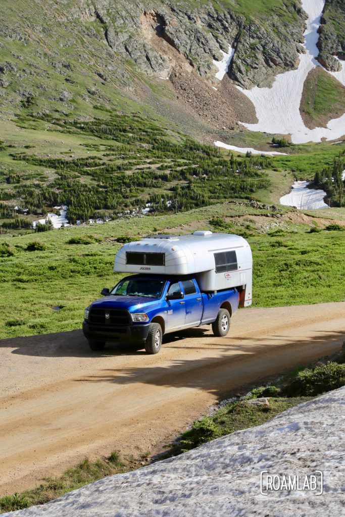 1970 Avion C11 Truck Camper driving among the glaciers on Old Fall River Road  in Rocky Mountains National Park