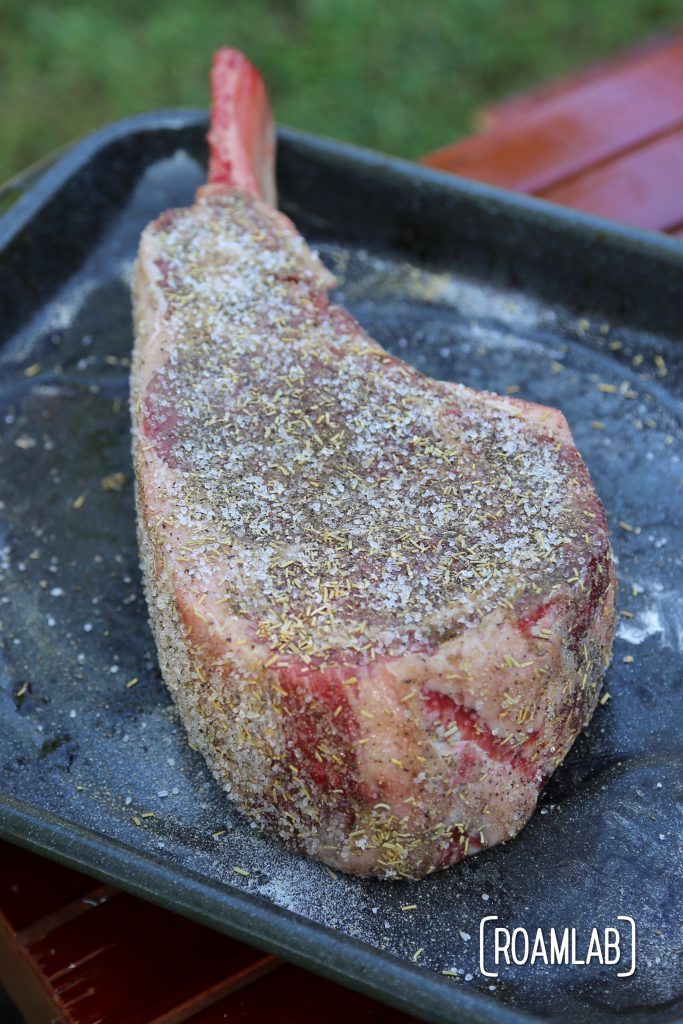 Grilling tomahawk steak over and open campfire is a challenging and delicious undertaking.