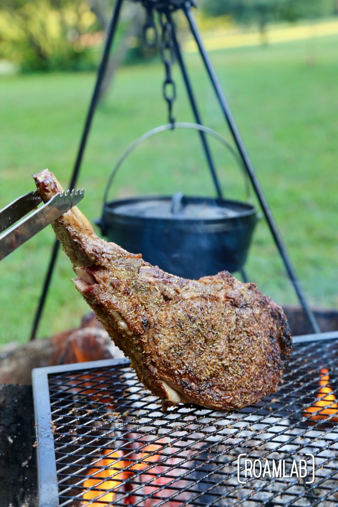 Grilling tomahawk steak over and open campfire is a challenging and delicious undertaking.