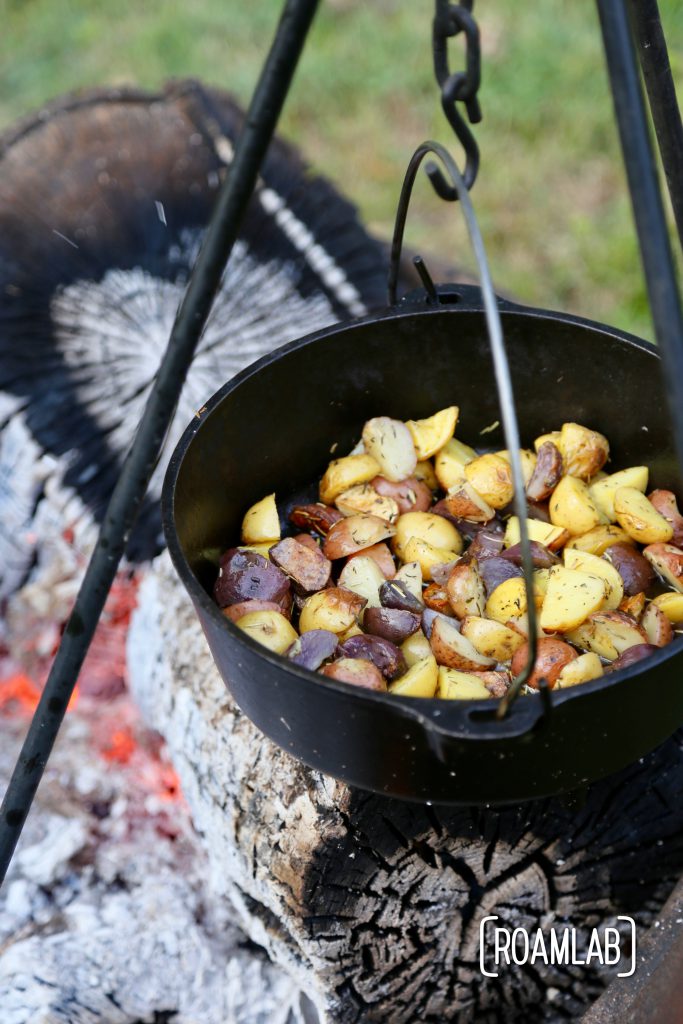 Grilling tomahawk steak over and open campfire is a challenging and delicious undertaking.