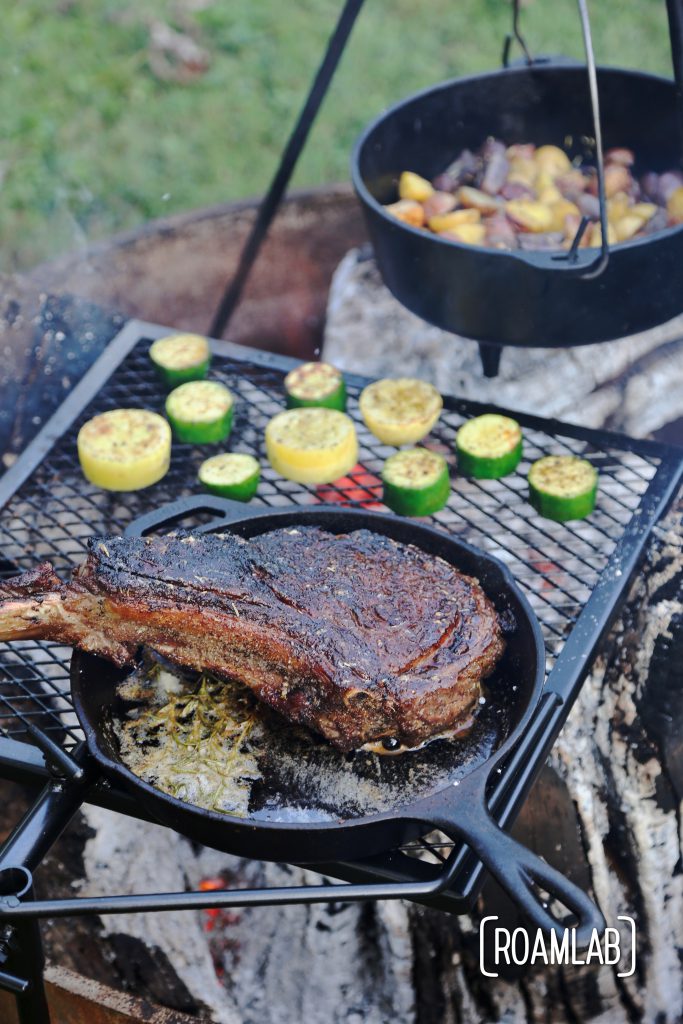 Grilling tomahawk steak over and open campfire is a challenging and delicious undertaking.