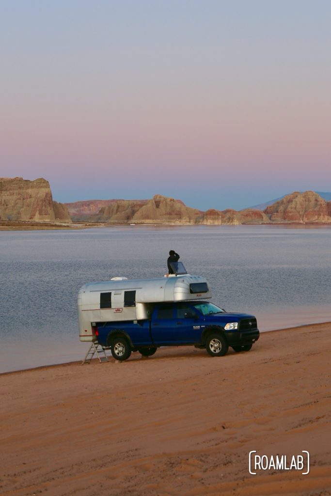 Beach camping along Lake Powel for off-road vehicles at Lone Rock Campground in Glen Canyon National Recreation Area just north of Page, Arizona.