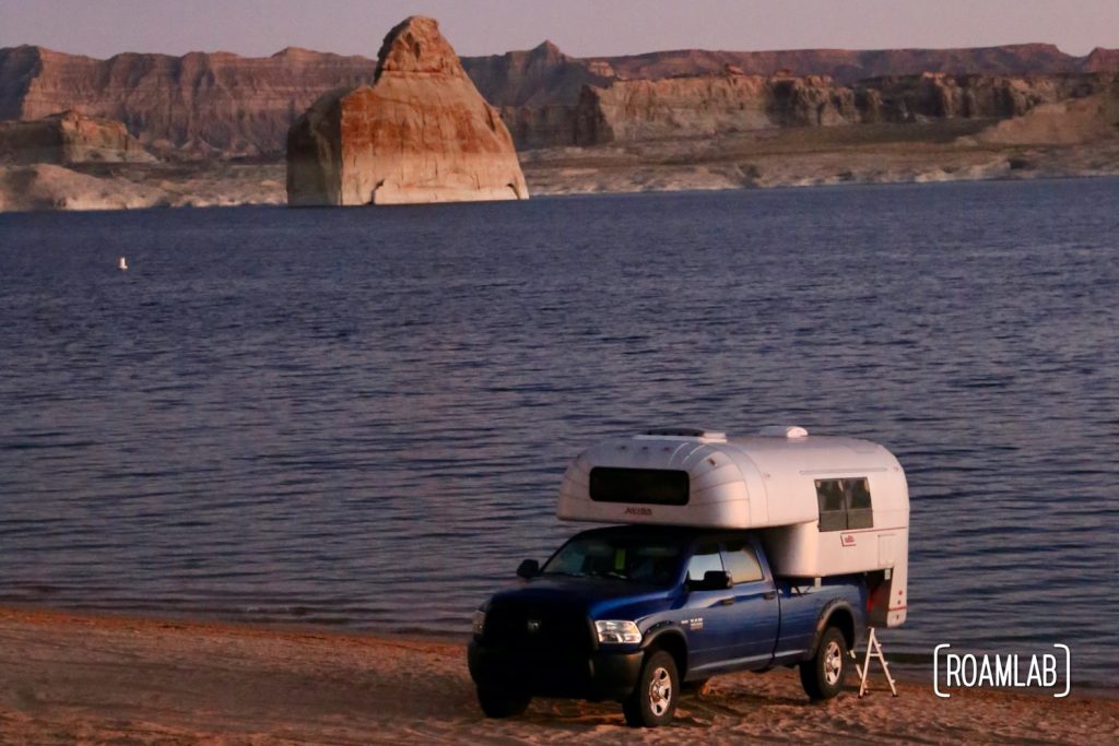Beach camping along Lake Powel for off-road vehicles at Lone Rock Campground in Glen Canyon National Recreation Area just north of Page, Arizona.