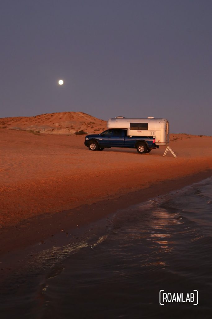 Beach camping along Lake Powel for off-road vehicles at Lone Rock Campground in Glen Canyon National Recreation Area just north of Page, Arizona.