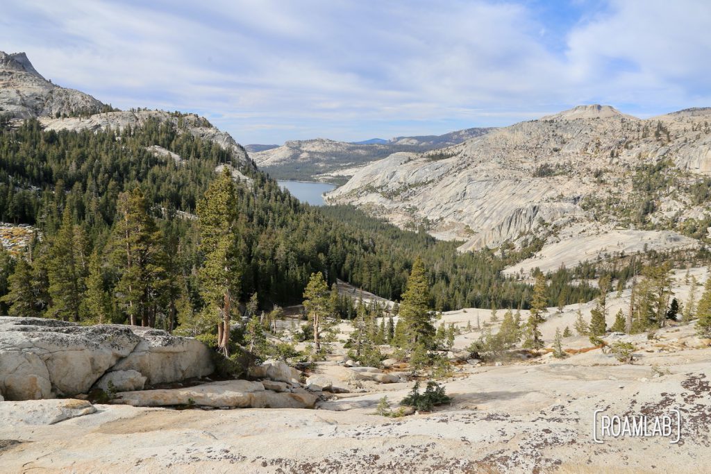 Hiking Cathedral Lakes Trail from Tuolumne Meadows to Lower Cathedral Lake, surrounded by Cathedral, Echo, and Tresidder Peaks in Yosemite National Park.