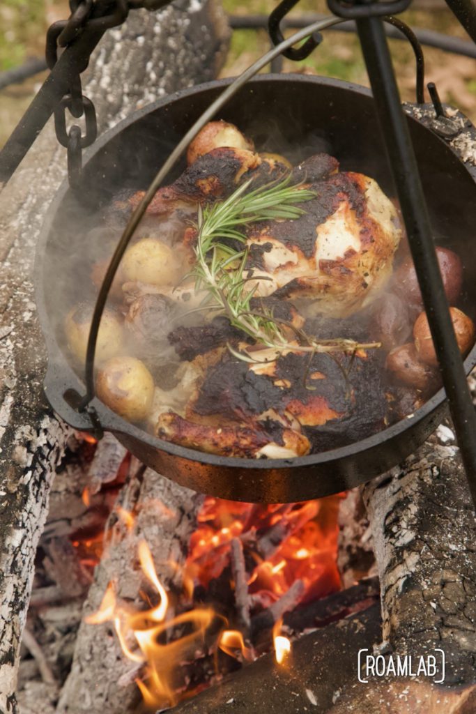 Roast this rosemary cornish game hen and potatoes recipe in a dutch oven over an open camp fire for a classy campground dinner or in your oven at home.