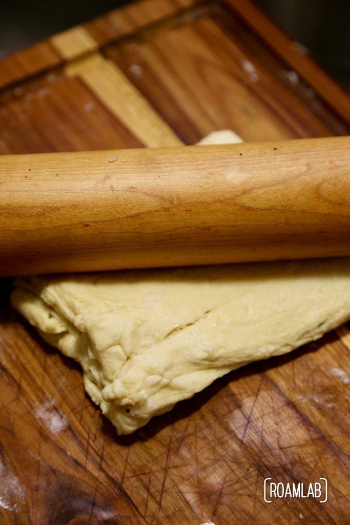 Preparing a campfire almond apricot baked brie