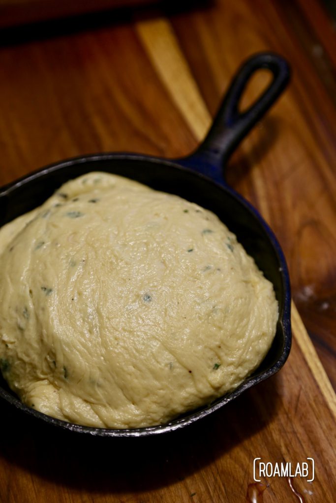 Preparing a campfire almond apricot baked brie