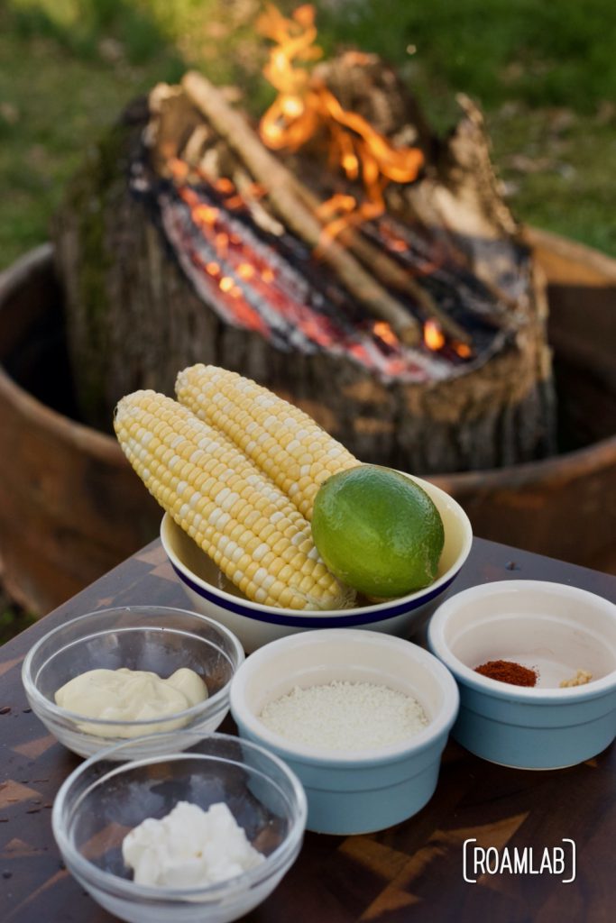 Enjoy this Mexican street corn campground noshing delight: tin foil elote campfire cooking appetizer recipe with cotija cheese, chili powder, and lime.