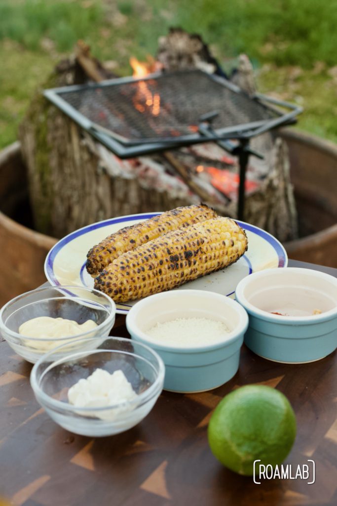 Enjoy this Mexican street corn campground noshing delight: tin foil elote campfire cooking appetizer recipe with cotija cheese, chili powder, and lime.