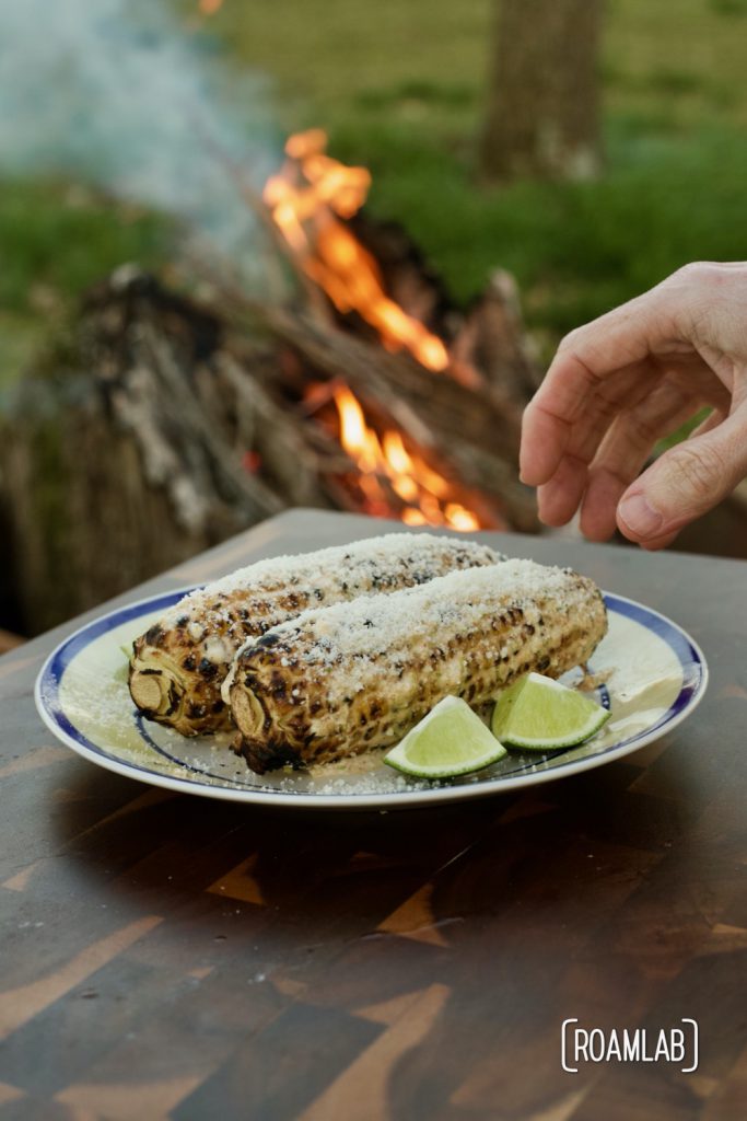 Enjoy this Mexican street corn campground noshing delight: tin foil elote campfire cooking appetizer recipe with cotija cheese, chili powder, and lime.