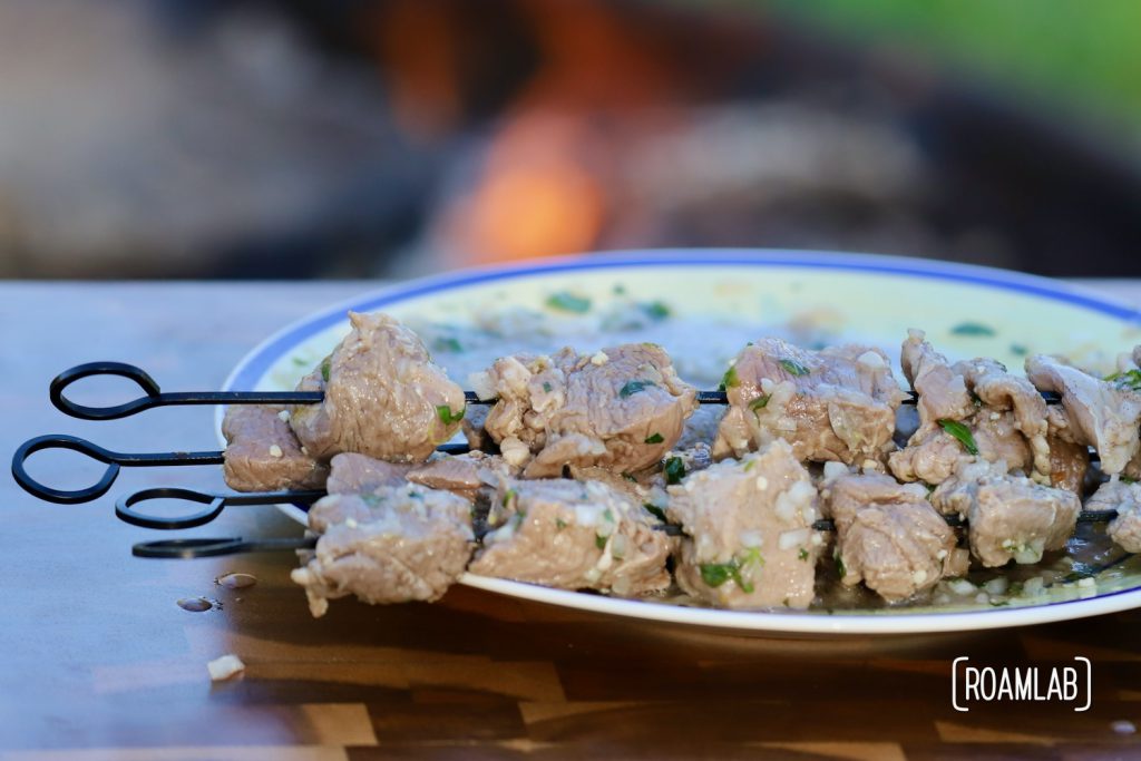 Grill this savory middle eastern Lamb Kabob campfire cooking dinner recipe with a side of toasted pita bread and yogurt for a delicious al fresco meal.