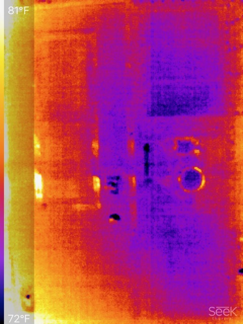 Thermal image of truck camper rear exterior with Seek watermark in lower right-hand corner