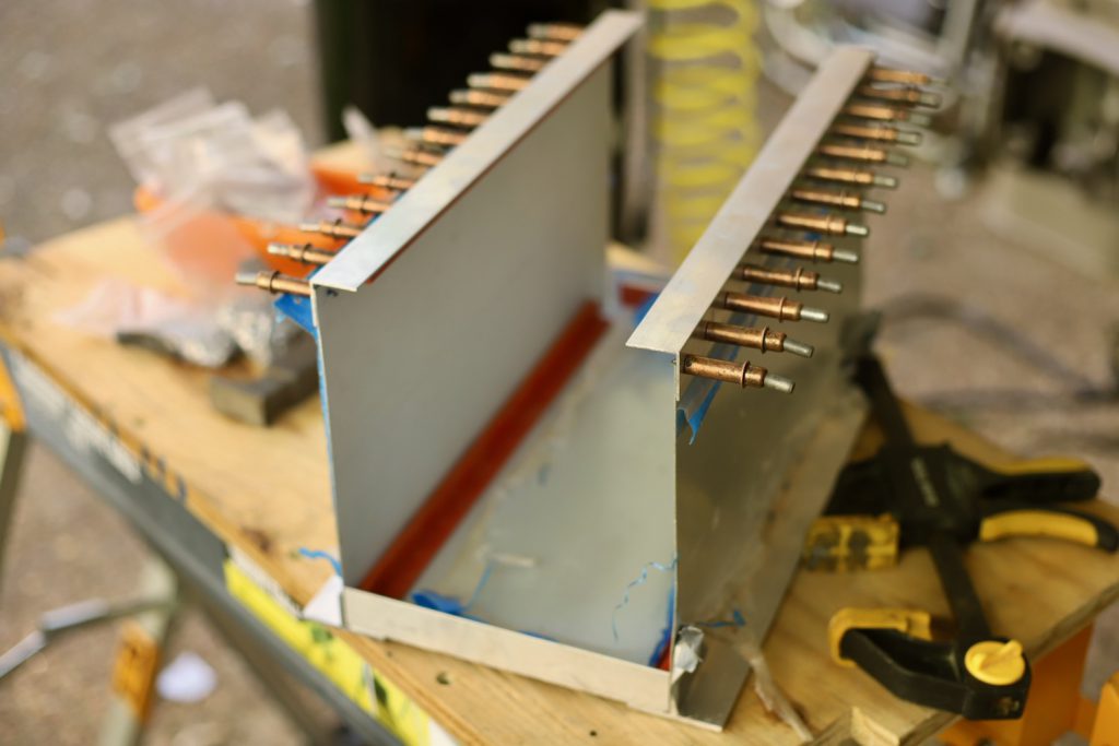 We make a custom battery box for our DIY lithium batteries featuring buck riveted aluminum, high impact rubber, and a plexiglass viewing window.