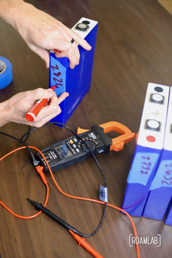 Marking voltage on battery cell.