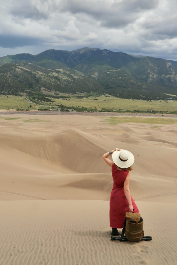 Woman looking out to the mountains in Great Sand Dunes National Park