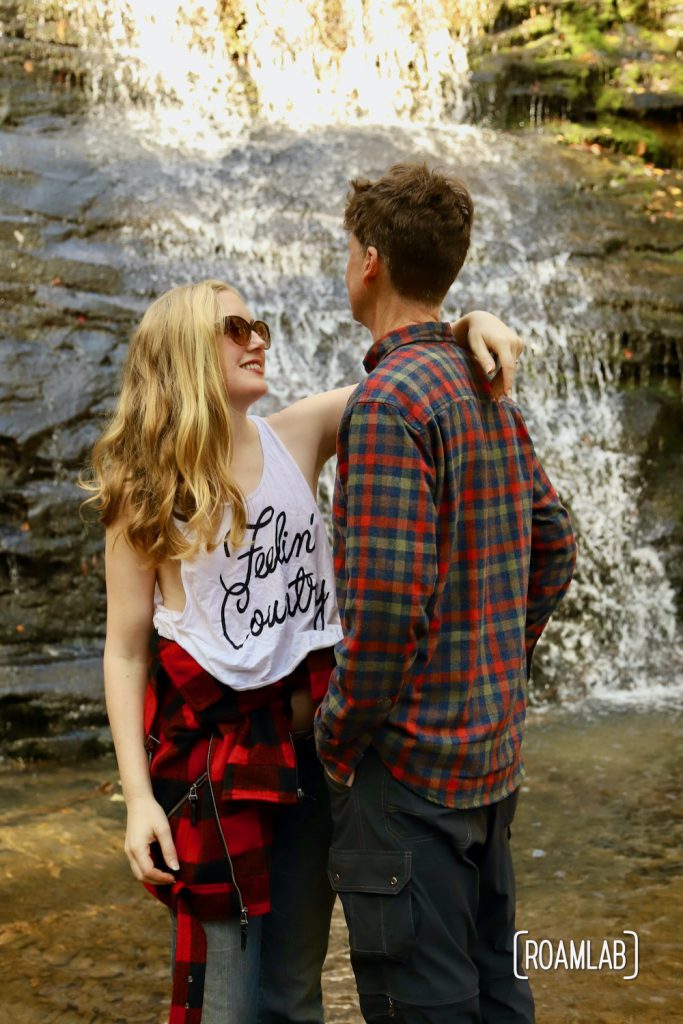 Man and woman in front of a waterfall in Prentice Cooper State Park, Tennessee.