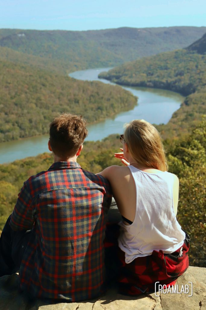 Man and woman looking out over the Tennessee River Gorge of Prentice Cooper State Park from Snoopers Rock.