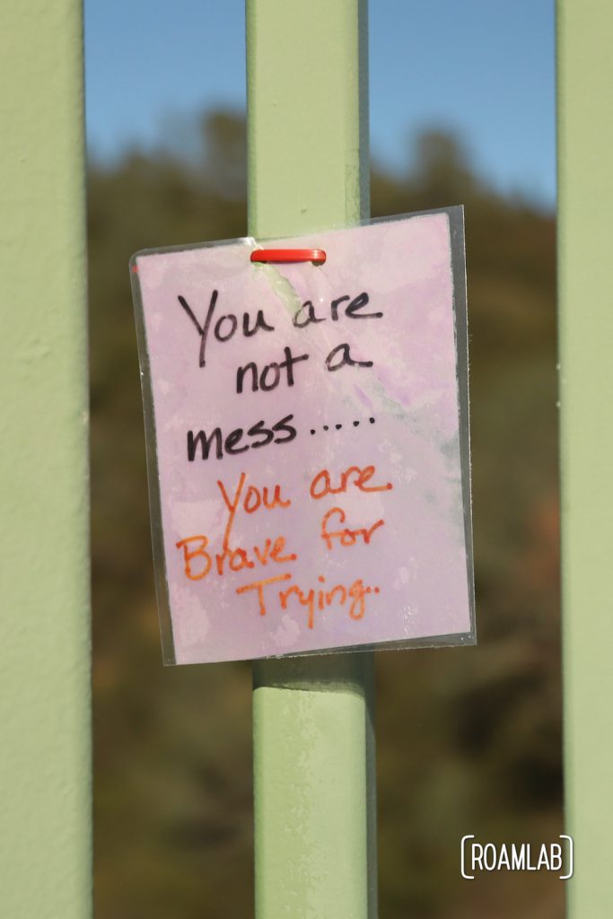 Laminated message tied to Foresthill Bridge: "You are not a mess...You are Brave for Trying"