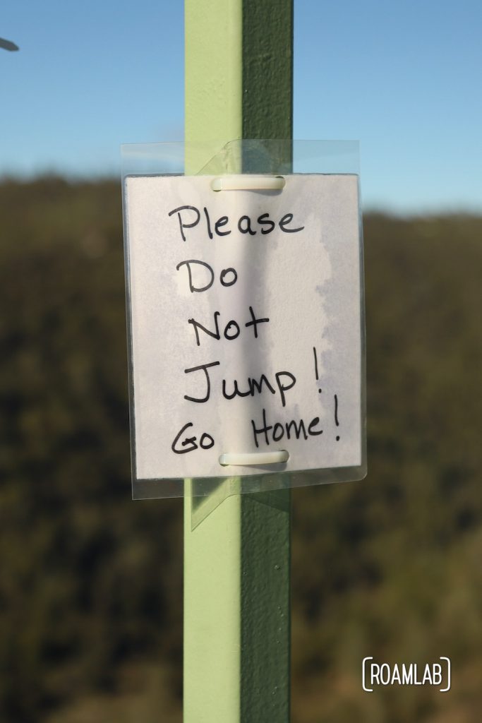 Laminated message tied to Foresthill Bridge: "Please Do Not Jump! Go Home!"