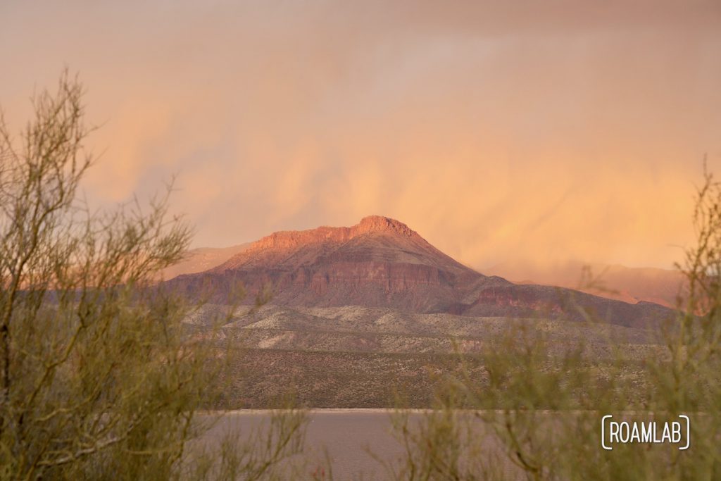 Brilliant pink buttes across Roosevelt Lake.