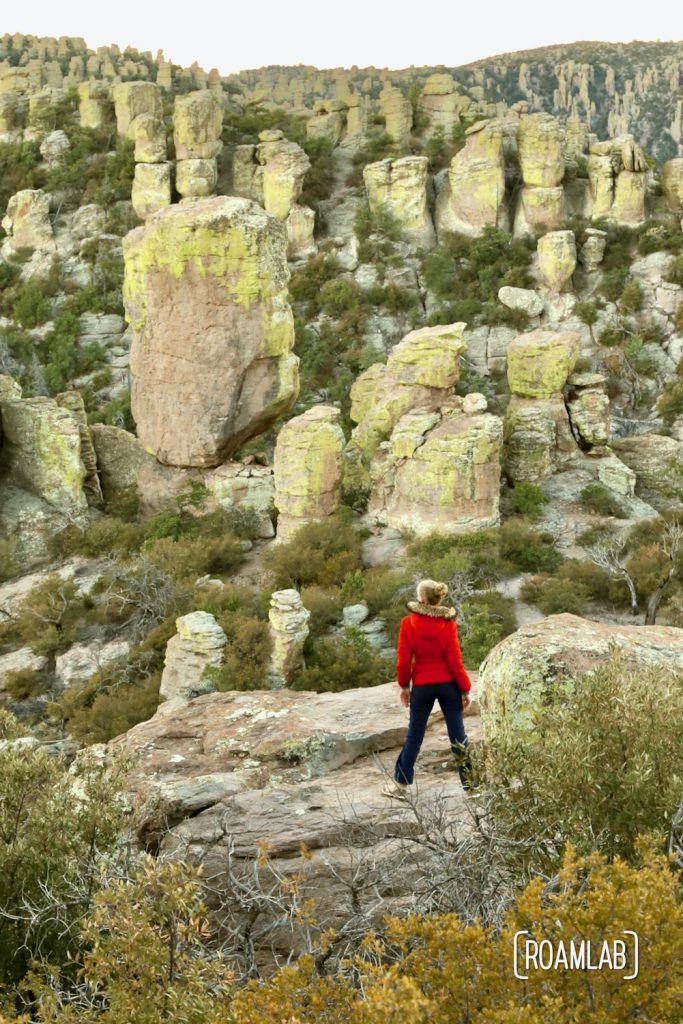 Woman standing among hoodoos on Echo Canyon Loop Trail at Chiricahua National Monument Arizona.